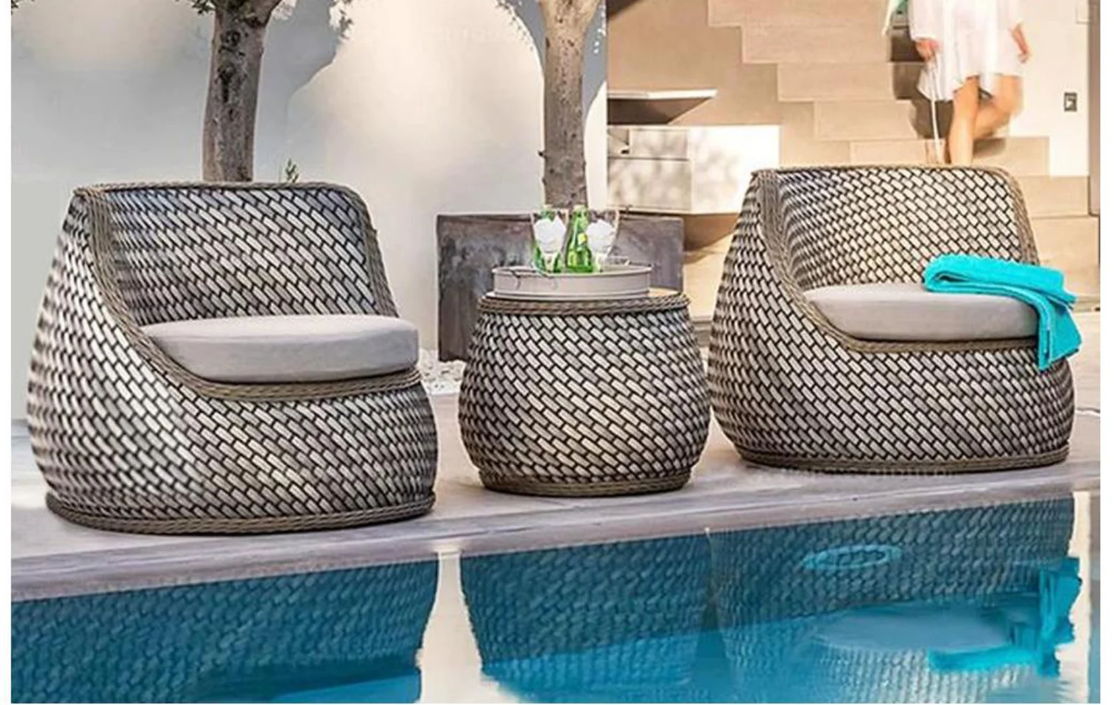 Woven armchairs and low tables
