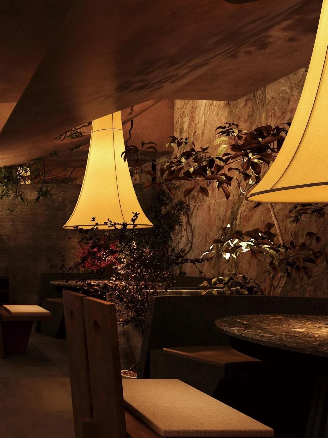 Oversized pendants and booth seating share a warm palette.