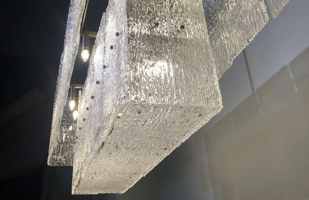 Layered textured-glass panels and exposed light sources viewed from below