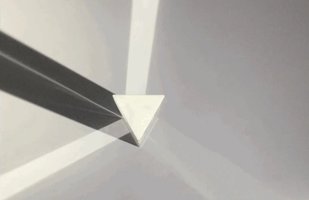 Hope in the Dark prism fixture and its refracted light on a wall