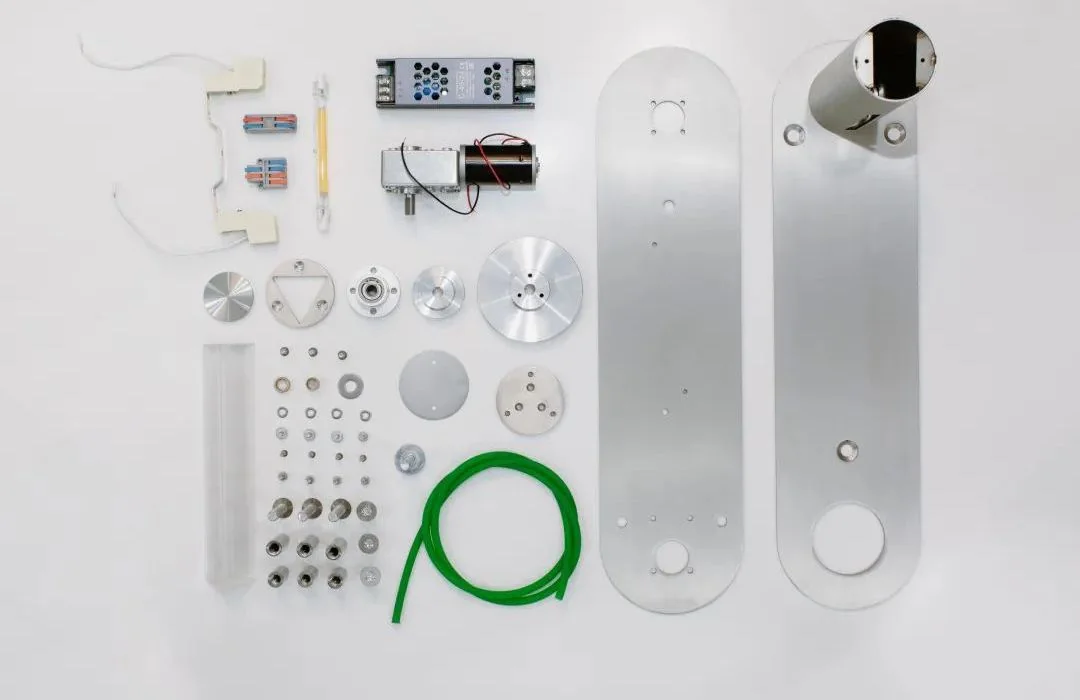 Components of the Hope in the Dark lighting fixture laid out before assembly