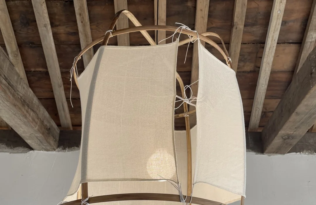 Translucent lantern and supporting frame below a timber ceiling